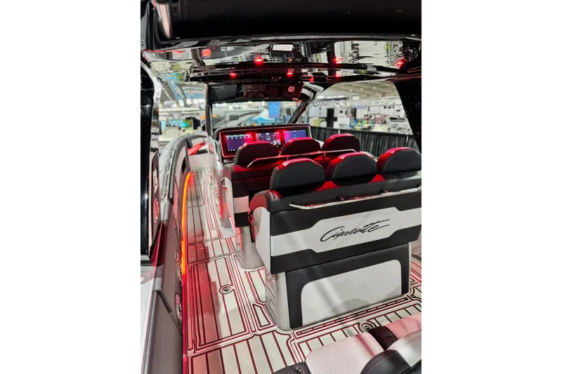 Slide: The Image of 2024 Cigarette 41' Nighthawk SD Edition interior with sleek seating and illuminated dashboard. - 5