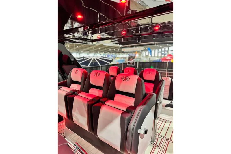 Slide: The Image of Luxurious interior of 2024 Cigarette 41' Nighthawk SD Edition with red ambient lighting. - 6