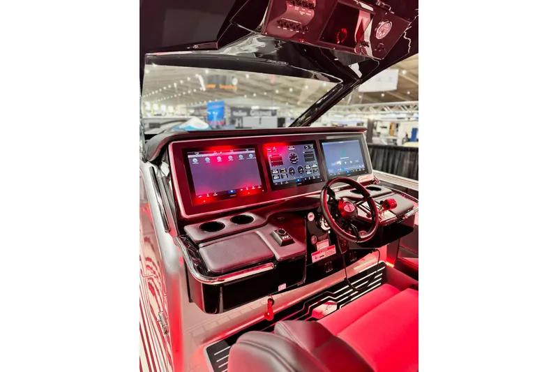 Slide: The Image of 2024 Cigarette 41' Nighthawk SD Edition boat cockpit with advanced digital displays and controls. - 7