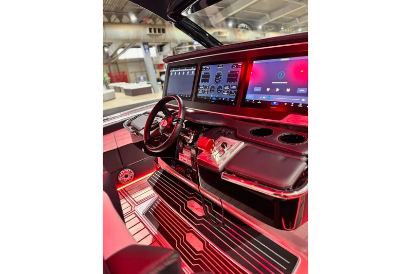 Slide: The Image of 2024 Cigarette 41' Nighthawk SD Edition cockpit with advanced controls and illuminated dashboard. - 8