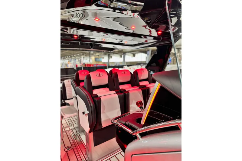 Slide: The Image of 2024 Cigarette 41' Nighthawk SD Edition interior with luxurious seating and ambient lighting. - 9