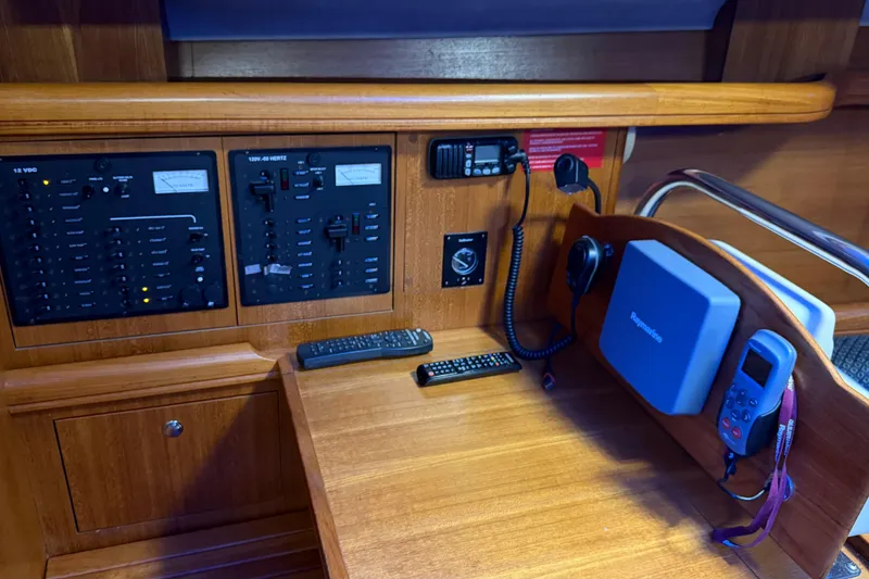 Slide: The Image of Control panel of a 2005 Hunter 38 yacht with navigation and communication equipment. - 16
