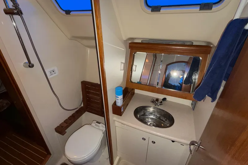 Slide: The Image of Compact bathroom in 2005 Hunter 38 sailboat with sink, toilet, and shower. - 22