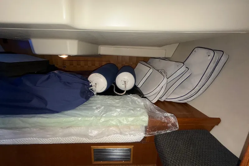 Slide: The Image of Interior cabin of 2005 Hunter 38 sailboat with cushions and fenders. - 23