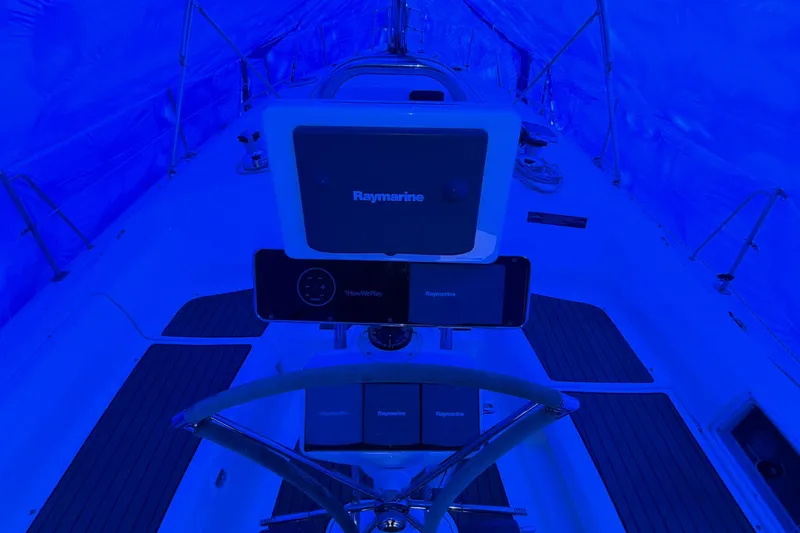 Slide: The Image of Steering area of a 2005 Hunter 38 sailboat, illuminated in blue light. - 29