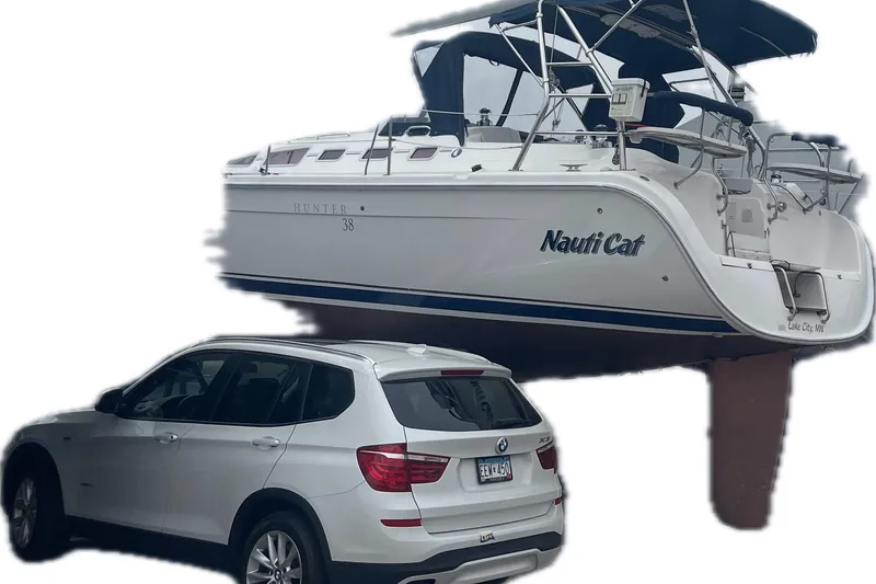 Slide: The Image of 2005 Hunter 38 sailboat and white car side by side. - 9