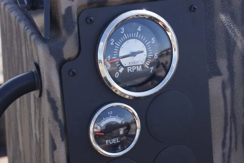 Slide: The Image of Close-up of RPM and fuel gauges on 2026 Excel 203 Bay Pro Elite boat. - 13