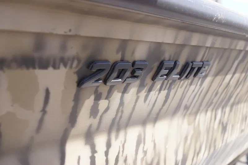 Slide: The Image of 2026 Excel 203 Bay Pro Elite boat with camouflage design and embossed lettering. - 18