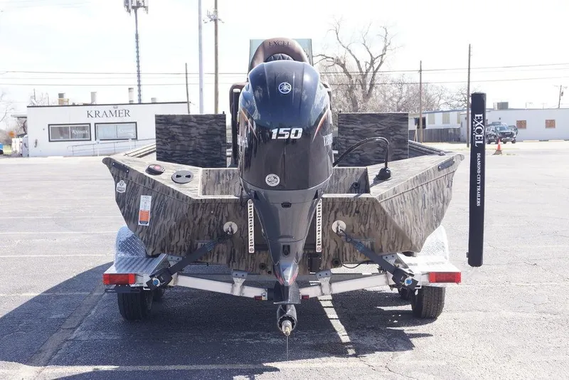 Slide: The Image of 2026 Excel 203 Bay Pro Elite boat on trailer, rear view with Yamaha 150 engine. - 2