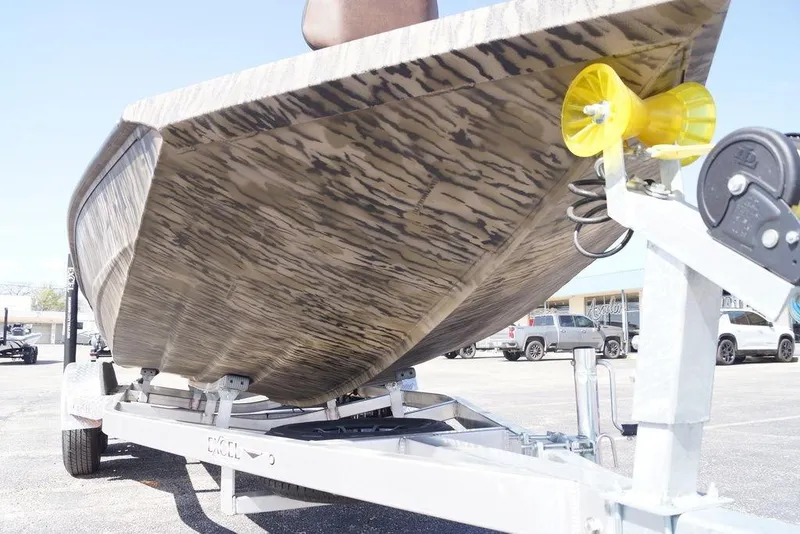 Slide: The Image of 2026 Excel 203 Bay Pro Elite boat on trailer, showcasing hull design. - 3