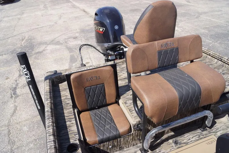 Slide: The Image of 2026 Excel 203 Bay Pro Elite boat interior with brown and black seating. - 8