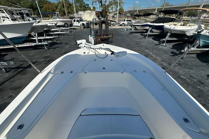 Slide: The Image of 2015 Tidewater 2000 Carolina Bay boat in a marina, surrounded by other boats. - 10