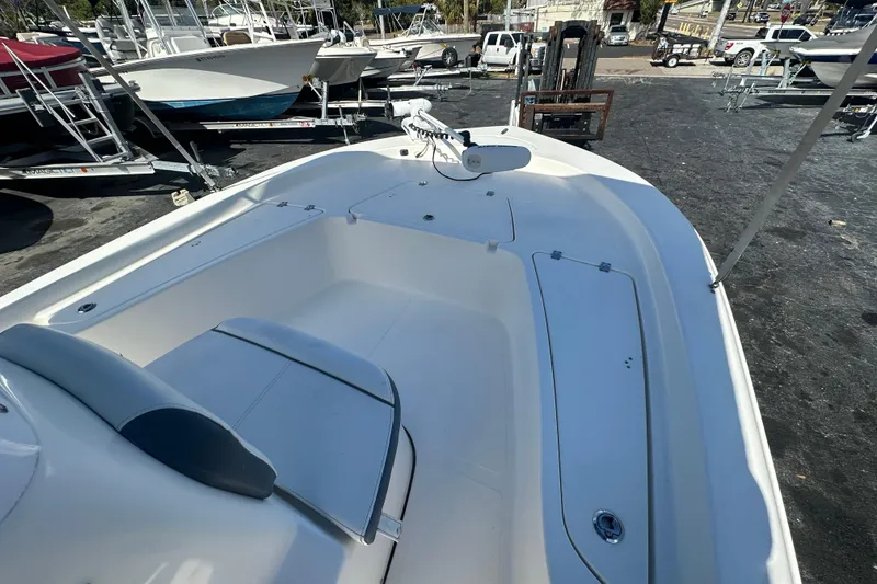 Slide: The Image of 2015 Tidewater 2000 Carolina Bay boat interior, featuring spacious seating and storage compartments. - 11