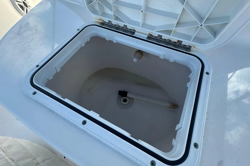 Slide: The Image of Open storage compartment on 2015 Tidewater 2000 Carolina Bay boat. - 14