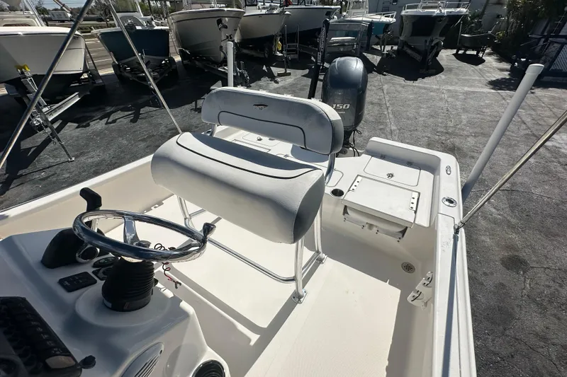 Slide: The Image of 2015 Tidewater 2000 Carolina Bay boat interior with steering wheel and seating. - 15