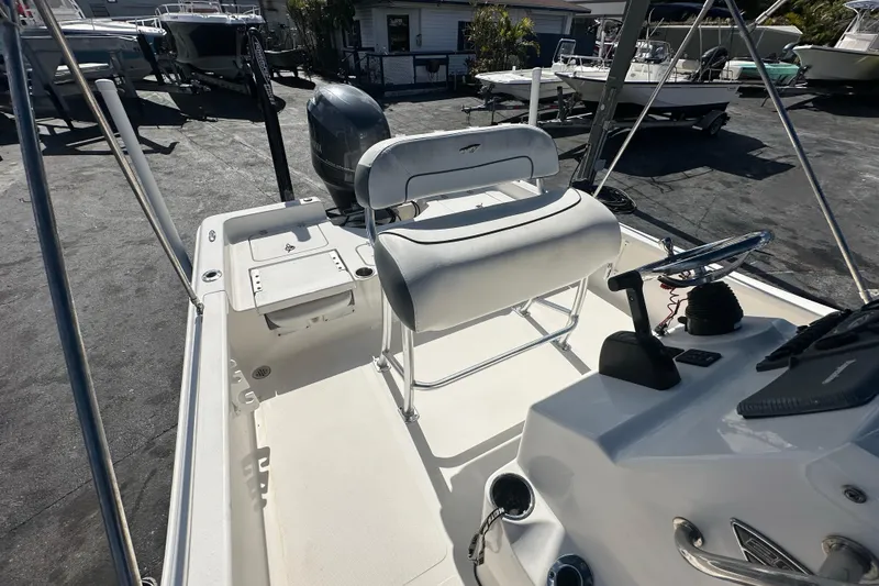 Slide: The Image of 2015 Tidewater 2000 Carolina Bay boat interior with seating and steering console. - 16