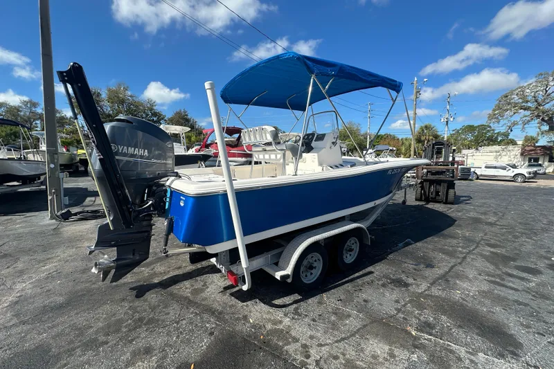 Slide: The Image of 2015 Tidewater 2000 Carolina Bay boat with Yamaha engine on trailer, blue hull, sunny day. - 5