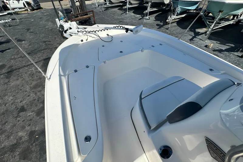 Slide: The Image of 2015 Tidewater 2000 Carolina Bay boat interior with seating and storage compartments. - 9