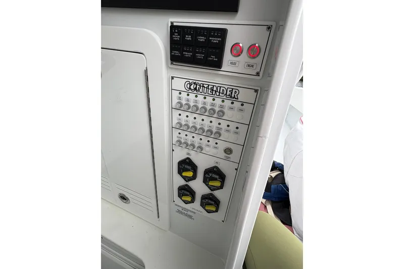 Slide: The Image of Control panel of 2025 Contender 32 ST boat with switches and dials. - 18