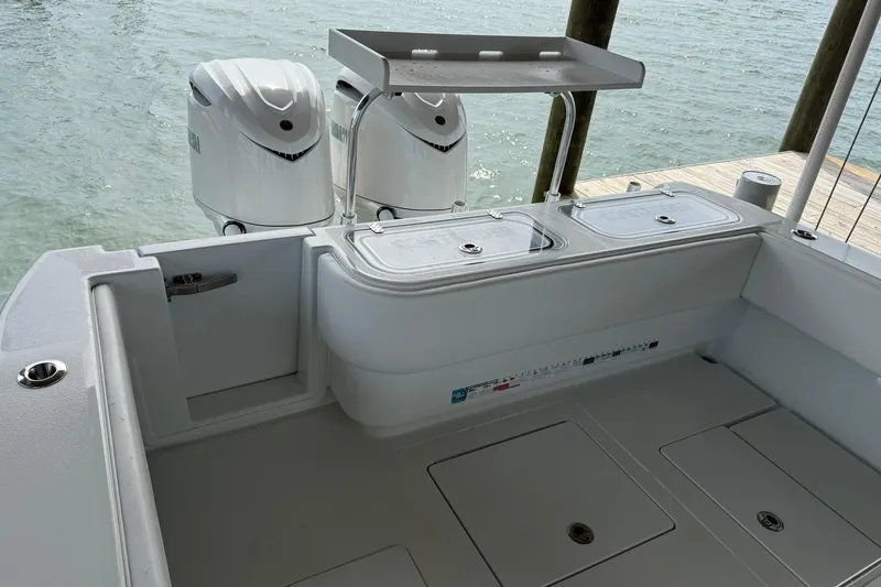 Slide: The Image of 2025 Contender 32 ST boat with dual outboard motors and spacious deck layout. - 26