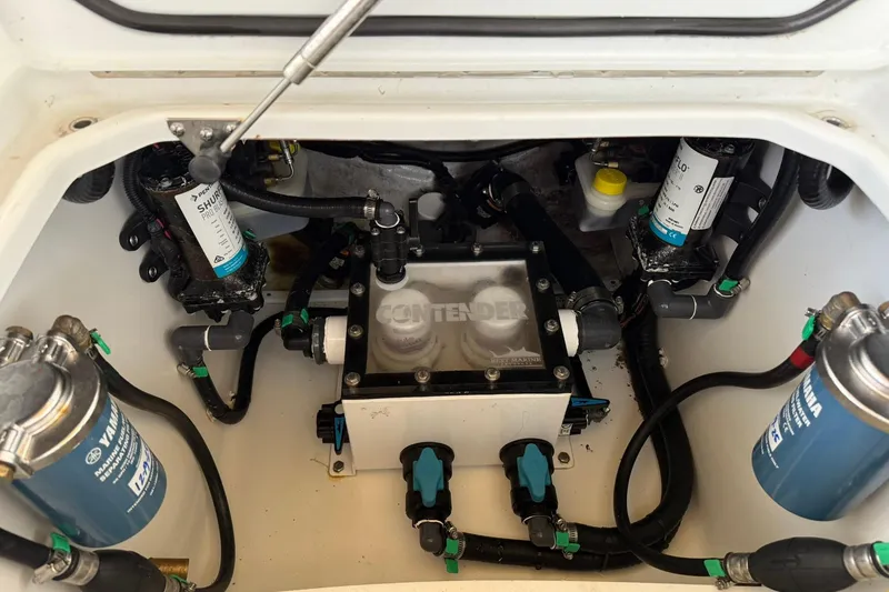 Slide: The Image of Engine compartment of 2025 Contender 32 ST boat, showcasing fuel and filtration systems. - 28