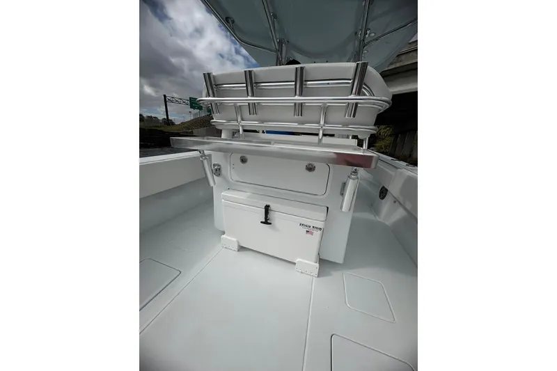 Slide: The Image of 2025 Contender 32 ST boat interior with storage compartments and seating. - 9