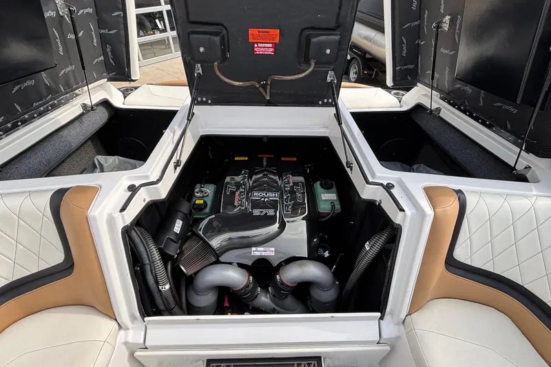 Slide: The Image of 2021 Tigé 25ZX boat engine compartment with Roush engine, open hatch view. - 10