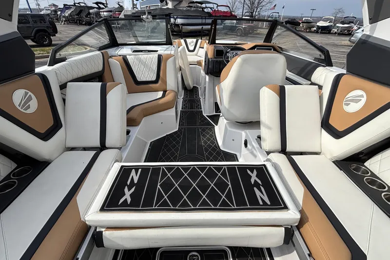 Slide: The Image of 2021 Tigé 25ZX boat interior with luxurious seating and modern design. - 15