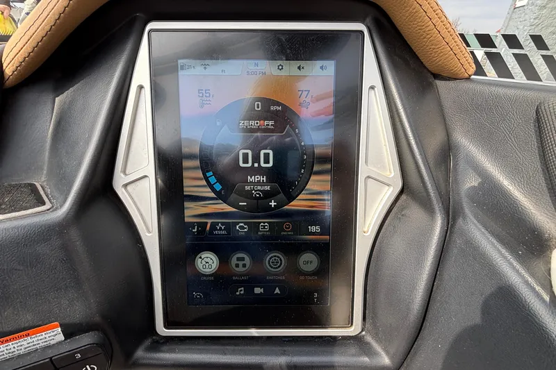 Slide: The Image of 2021 Tigé 25ZX boat dashboard display showing speed and control settings. - 25