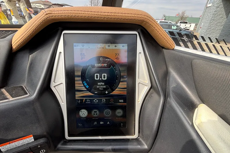 Slide: The Image of 2021 Tigé 25ZX boat dashboard with touchscreen display showing speed and controls. - 26