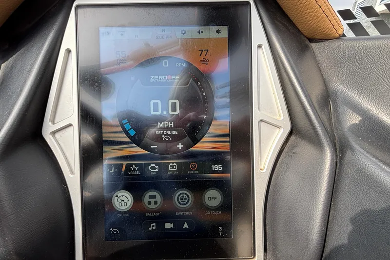 Slide: The Image of Touchscreen display of a 2021 Tigé 25ZX boat showing speed and control settings. - 27