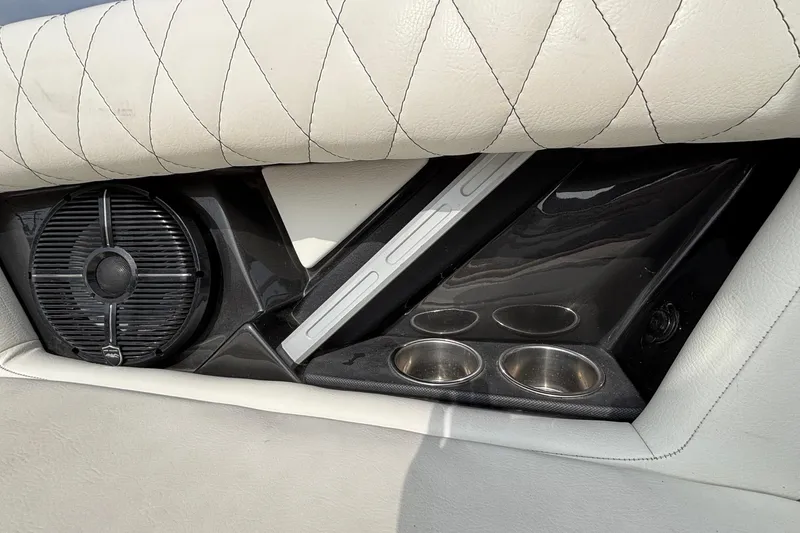 Slide: The Image of 2021 Tigé 25ZX interior detail with speaker and cup holders. - 36