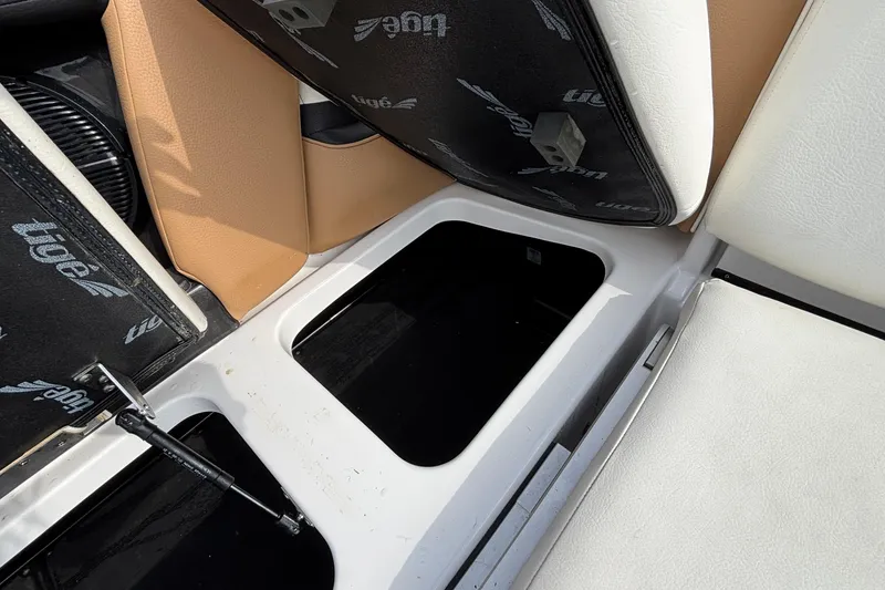 Slide: The Image of 2021 Tigé 25ZX boat interior storage compartments with open seats. - 53