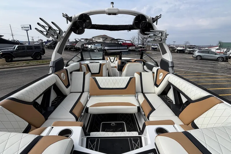 Slide: The Image of 2021 Tigé 25ZX boat interior with luxurious seating and modern design. - 6