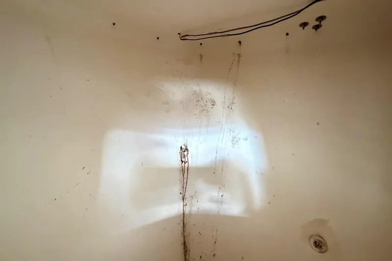 Slide: The Image of Interior of a 2000 Eastern 22 Lobster Fisherman boat, showing wiring and surface details. - 16