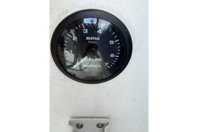 Slide: The Image of Tachometer gauge on a 2000 Eastern 22 Lobster Fisherman boat, displaying RPM. - 17