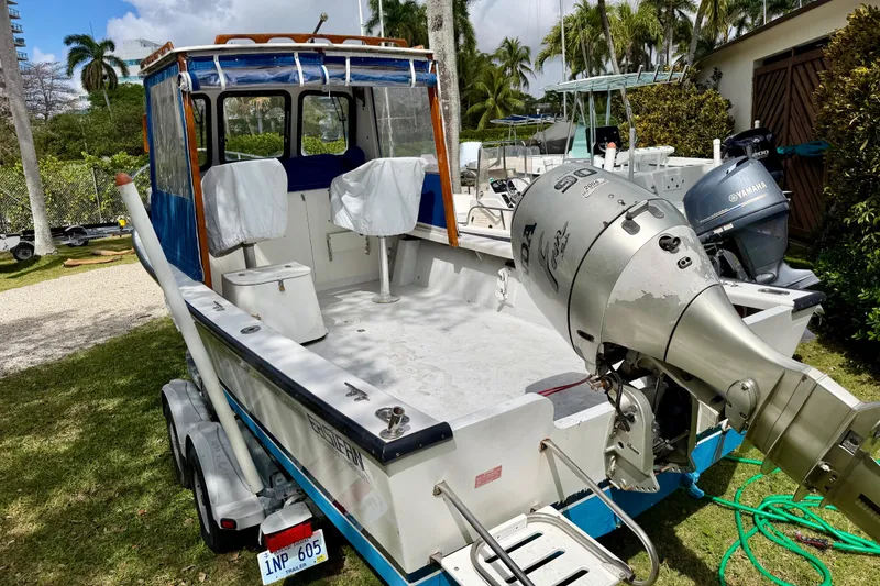 Slide: The Image of 2000 Eastern 22 Lobster Fisherman boat with Honda outboard motor, parked on a trailer. - 5