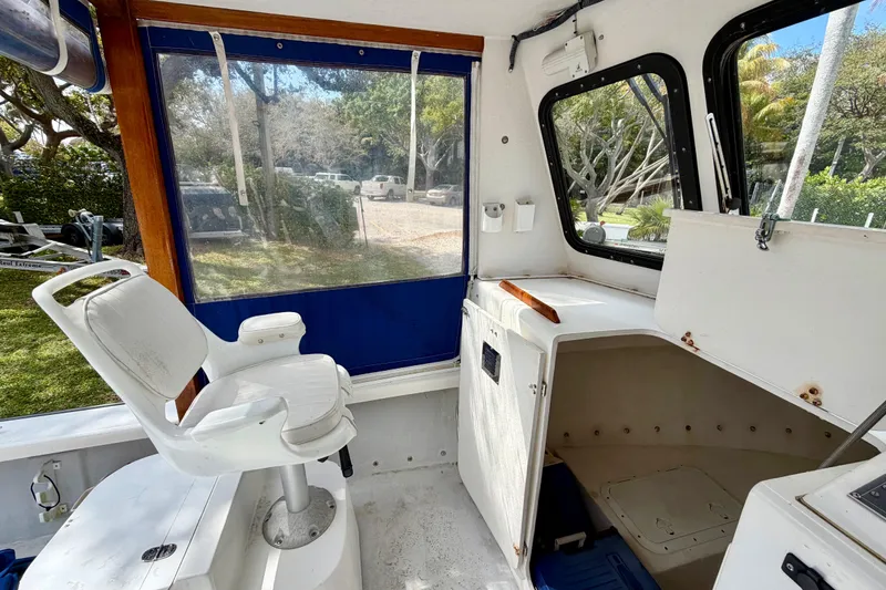 Slide: The Image of Interior of a 2000 Eastern 22 Lobster Fisherman boat with seating and storage. - 9