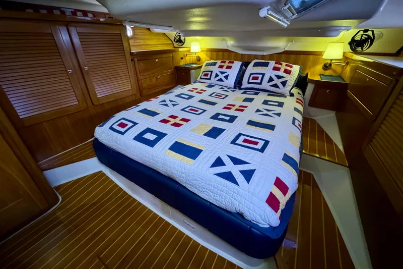 Slide: The Image of Luxurious cabin interior of 2005 Catalina 470 yacht with nautical-themed bedding. - 20