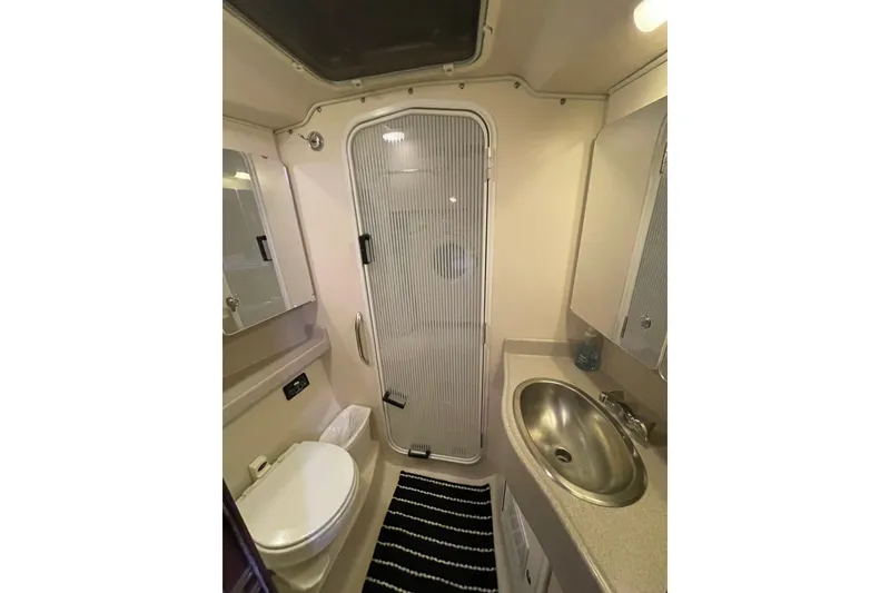 Slide: The Image of Bathroom interior of 2005 Catalina 470 yacht with shower, sink, and toilet. - 26