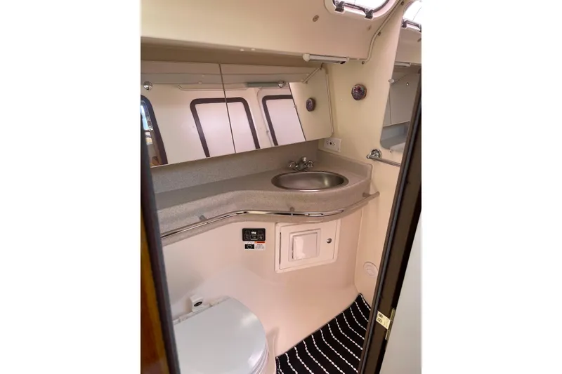 Slide: The Image of 2005 Catalina 470 yacht bathroom with sink, mirror, and toilet. - 28
