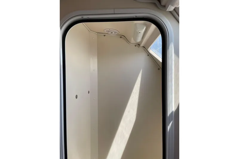 Slide: The Image of Interior view of a 2005 Catalina 470 sailboat cabin with natural light. - 30