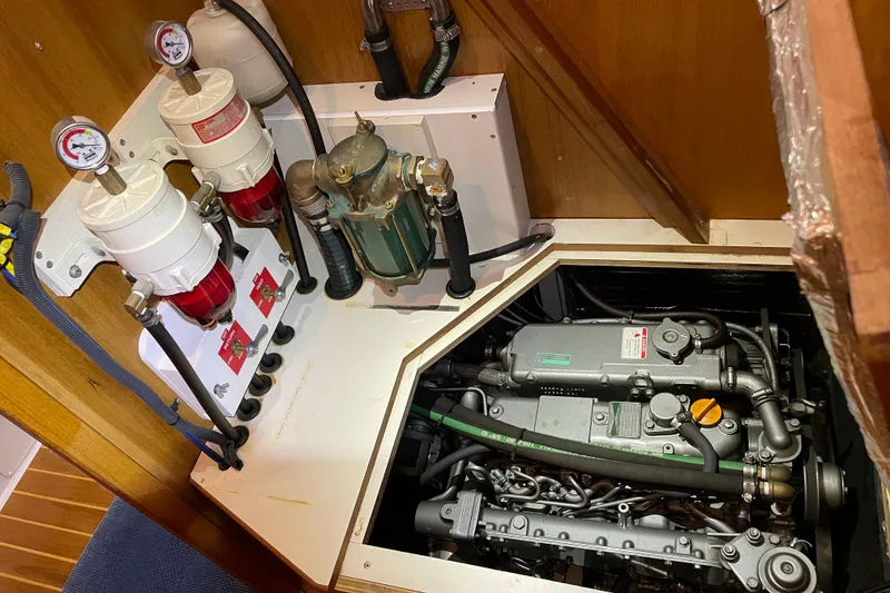 Slide: The Image of Engine compartment of a 2005 Catalina 470 sailboat, showcasing fuel filters and engine components. - 31