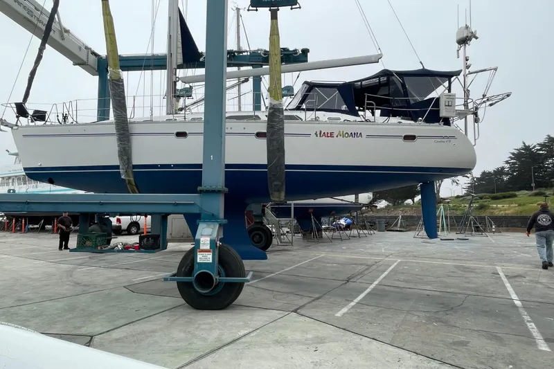 Slide: The Image of 2005 Catalina 470 sailboat in dry dock, undergoing maintenance. - 35