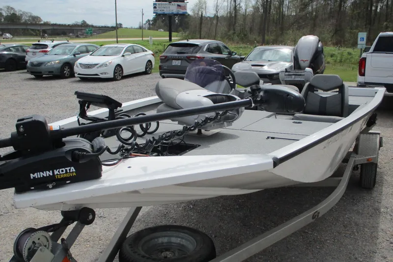 Slide: The Image of 2021 G3 Sportsman 1710 boat with Minn Kota Terrova motor in parking lot. - 2