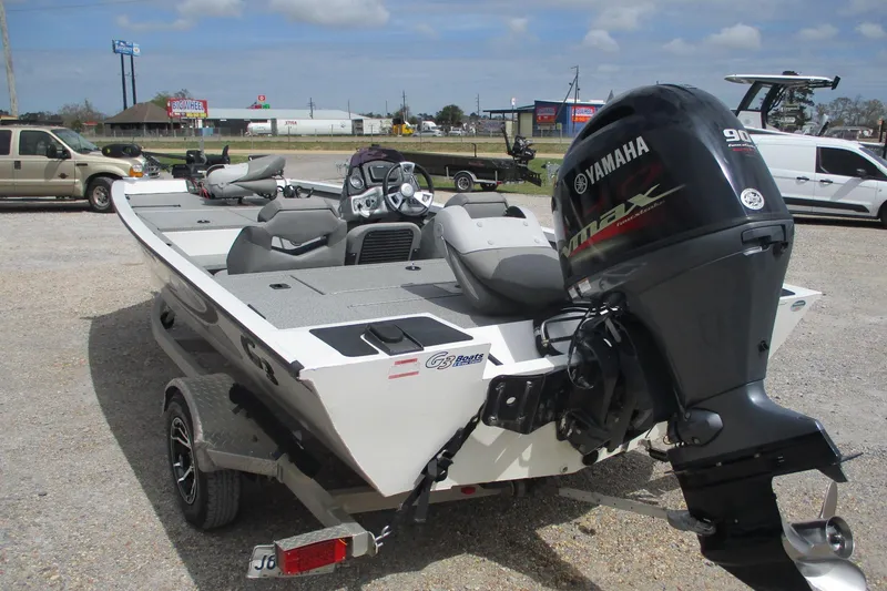 Slide: The Image of 2021 G3 Sportsman 1710 boat with Yamaha VMAX engine in a parking lot. - 4