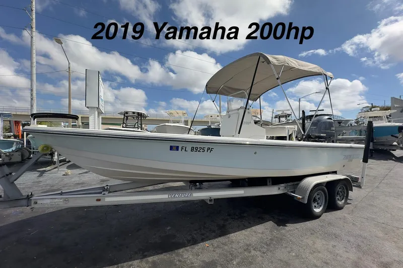 The Image of 2012 Pathfinder 2200 V boat with 2019 Yamaha 200hp engine on trailer. - 0