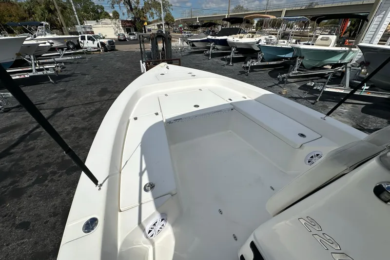Slide: The Image of 2012 Pathfinder 2200 V boat on display at a marina with other vessels. - 11