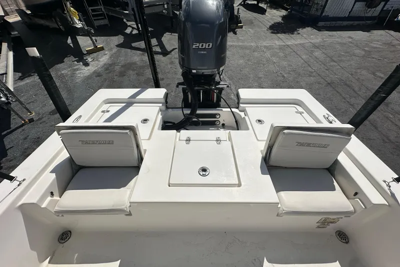 Slide: The Image of 2012 Pathfinder 2200 V boat with Yamaha 200 engine, featuring rear seating and storage. - 17