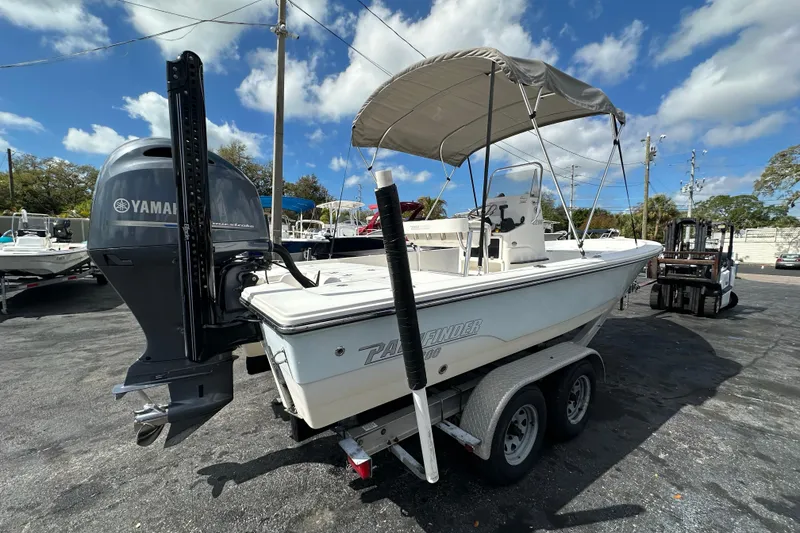 Slide: The Image of 2012 Pathfinder 2200 V boat with Yamaha engine on trailer, under blue sky. - 7
